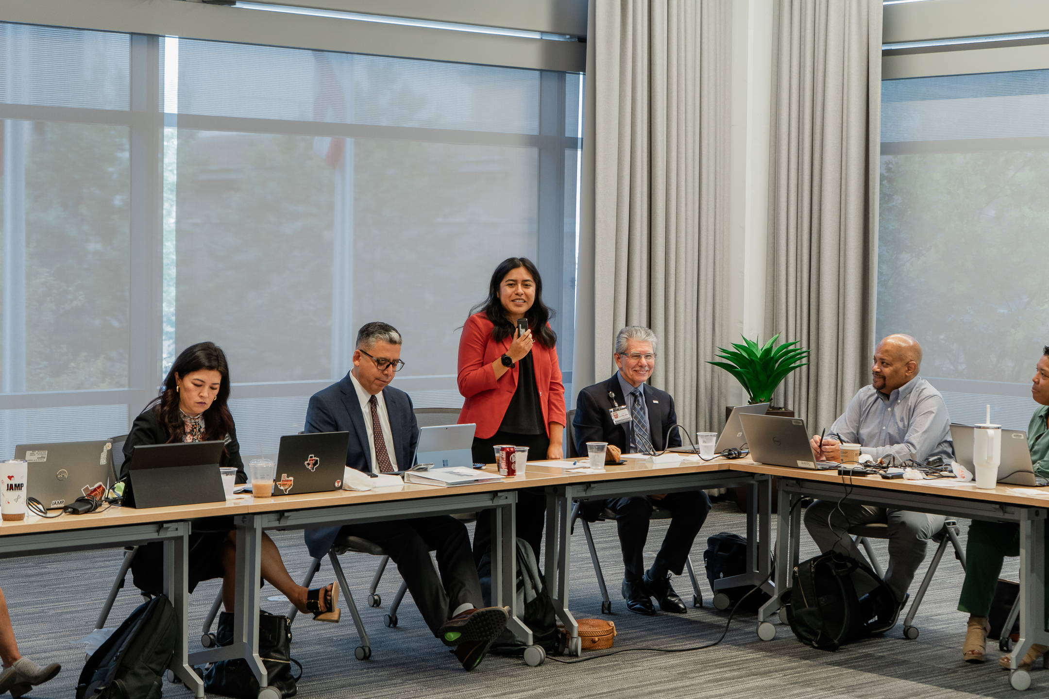 Dr. Fuentes speaking in front of the JAMP Council