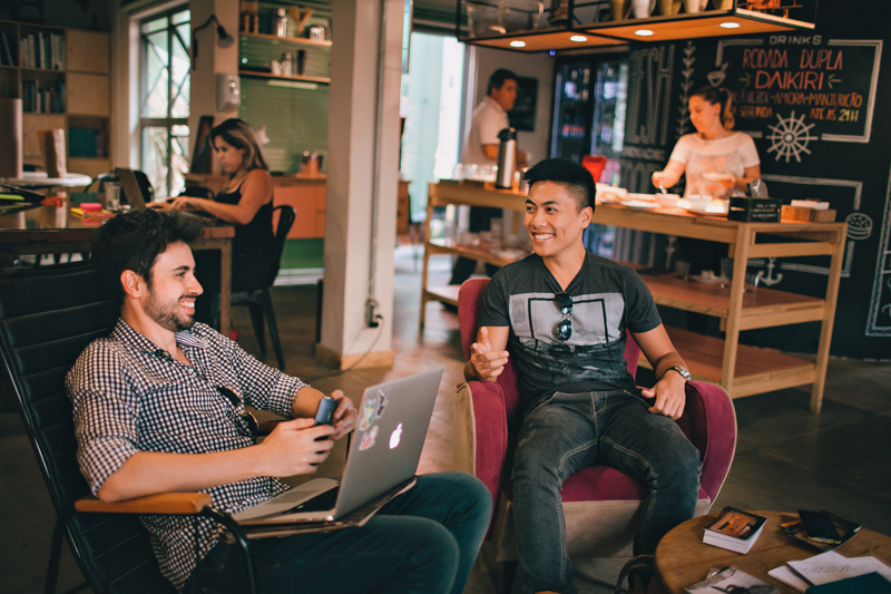 men at coffee shop laughing